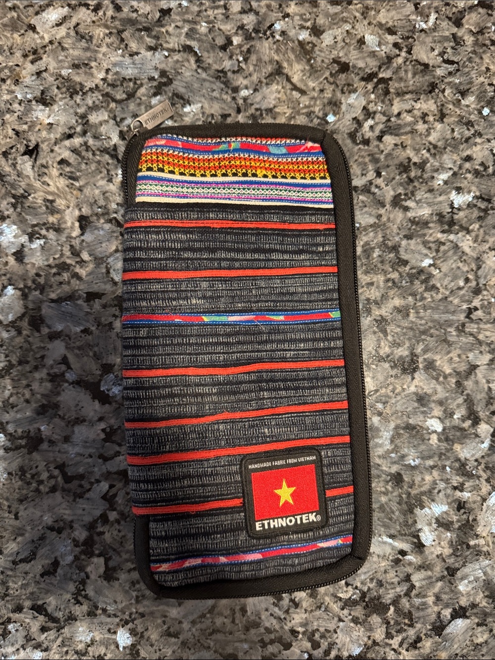 Ethnotek Chiburi travel wallet. Multiple pockets for cash, passport, phone.